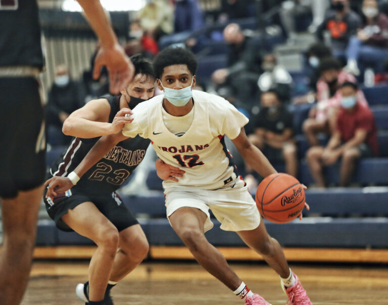 Trojans Advance to District Semis, Survive St. Johns, 66-55