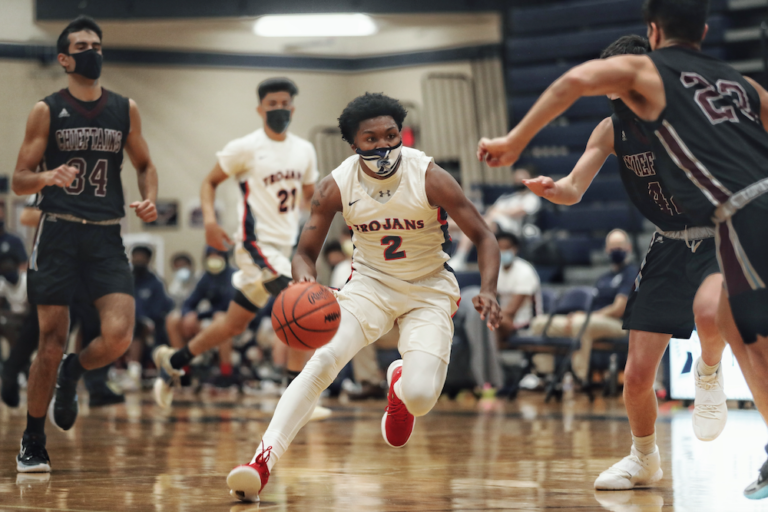 Marcus Wourman and Brevin Jackson Lead Trojans To 57-48 Comeback Win Over Okemos
