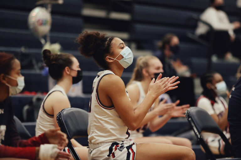 No. 2 Trojans Begin Their Championship March with 65-50 Win Against Holt