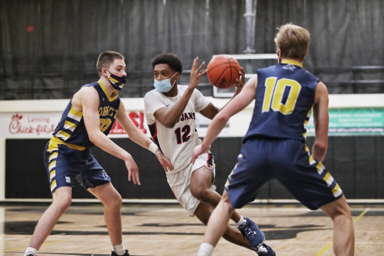 Trojans Escape DeWitt in Overtime, 59-52, Head to District Finals