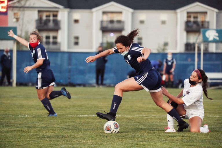 Staunch Defense, 2 Long Shot Goals As Trojans Tie with Okemos